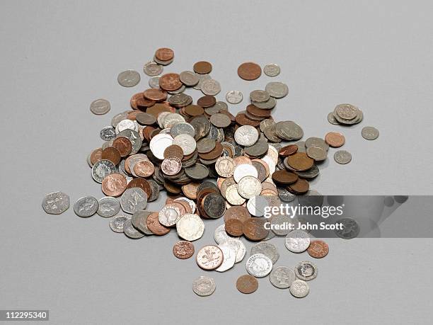a pile fo coins - stack stock pictures, royalty-free photos & images