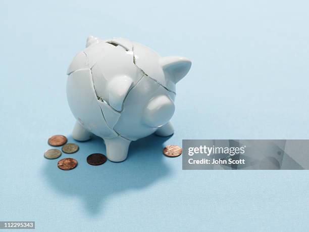 a broken piggy bank - smashed piggy bank stock pictures, royalty-free photos & images