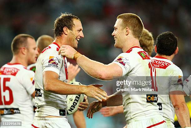 Mark Gasnier and Ben Creagh of the Dragons celebrate a try by Gasnier during the round six NRL match between the South Sydney Rabbitohs and the St...