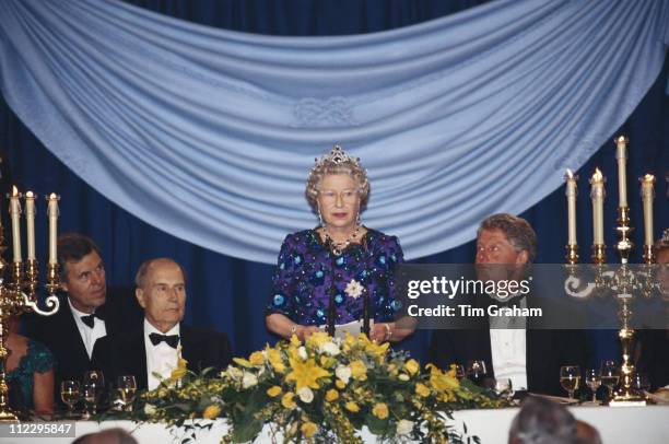 Queen Elizabeth II addresses a banquet also attended by President of France, Francois Mitterrand , and U.S. President Bill Clinton, at Portsmouth...