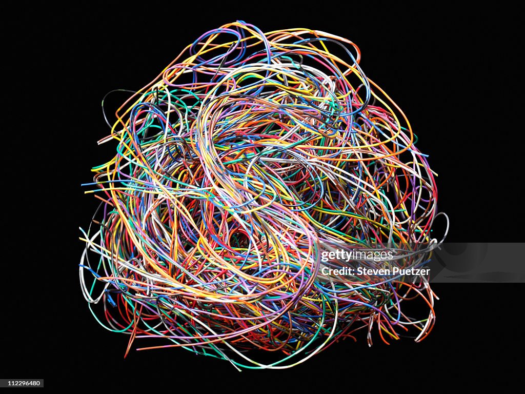 Tangled ball of colored wires against black