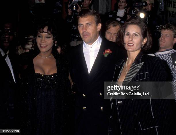Singer Whitney Houston, actor Kevin Costner and wife Cindy Costner attend "The Bodyguard" Hollywood Premiere on November 23, 1992 at Mann's Chinese...