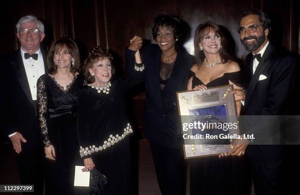 Talk show host Phil Donahue, Terre Thomas, Rose Marie Mantell, singer Whitney Houston, actress Marlo Thomas and producer Tony Thomas attend the 13th...