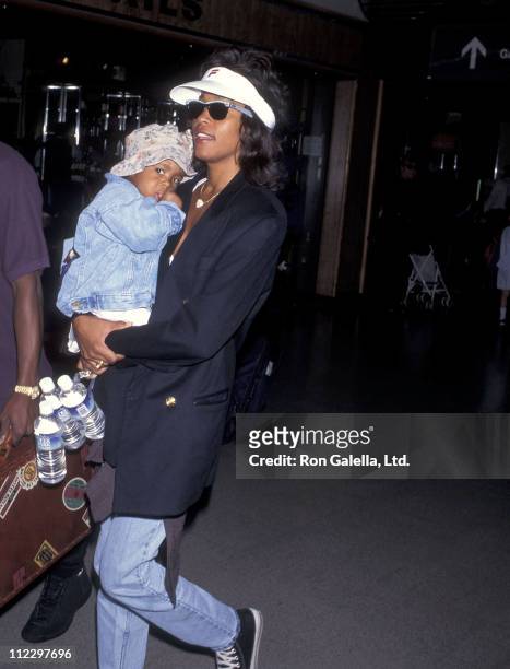 Singer Whitney Houston and daughter Bobbi Kristina Brown depart for New York City on July 1, 1995 at Los Angeles International Airport in Los...