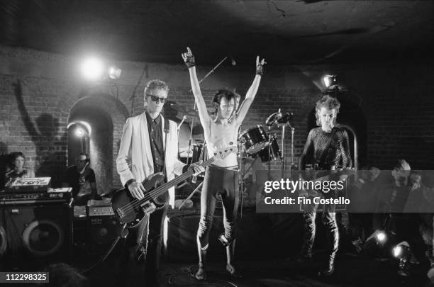 Bauhaus perform live on stage at the Roundhouse in Camden, London during the filming of their video to 'Ziggy Stardust' in August 1982. Left to...