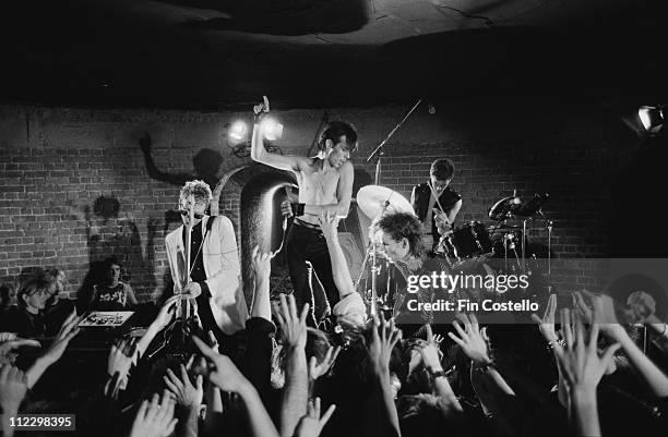 Bauhaus perform live on stage at the Roundhouse in Camden, London during the filming of their video to 'Ziggy Stardust' in August 1982. Left to...
