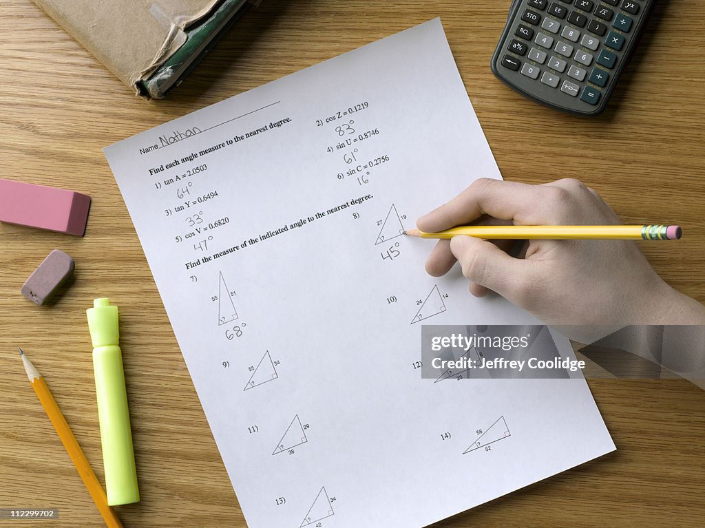Hand Solving Math Worksheet High-Res Stock Photo - Getty Images