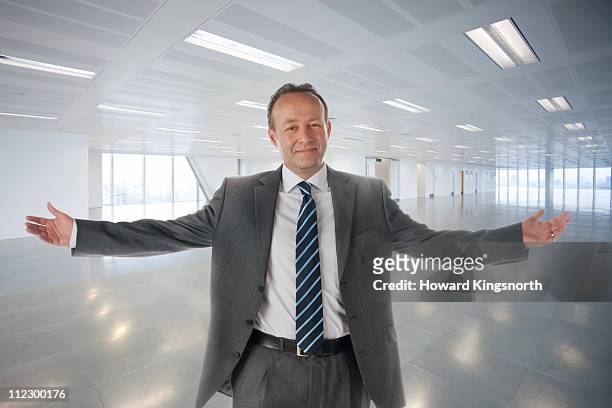 male executive standing with arms outstretched in - arms outstretched bildbanksfoton och bilder