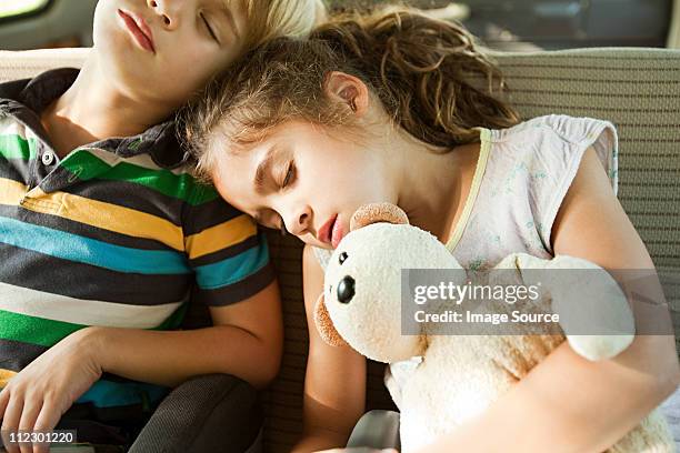 children asleep in back seat of car - sister day stock pictures, royalty-free photos & images