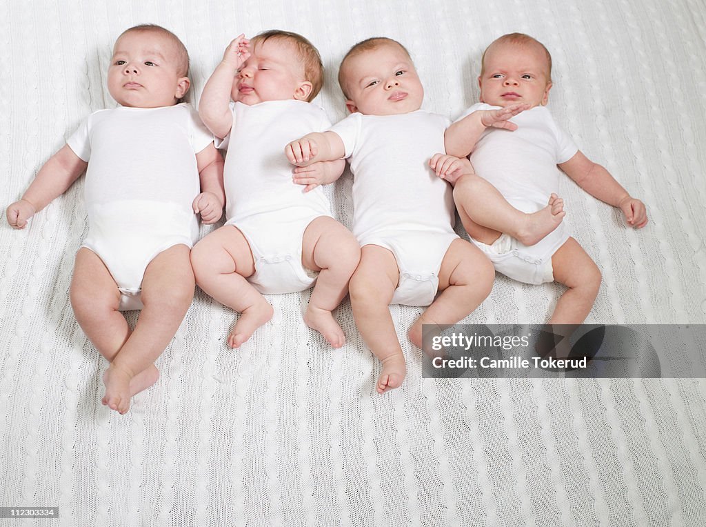 Four Babies on Bed