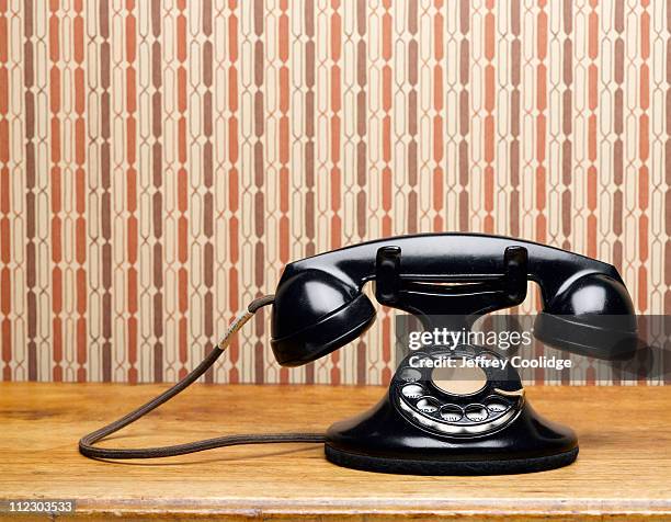 vintage phone on table - old fashioned telephone stock pictures, royalty-free photos & images