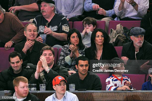 John McEnroe and Danielle Staub attend the Pittsburgh Penguins vs New York Rangers game at Madison Square Garden on January 25, 2010 in New York City.