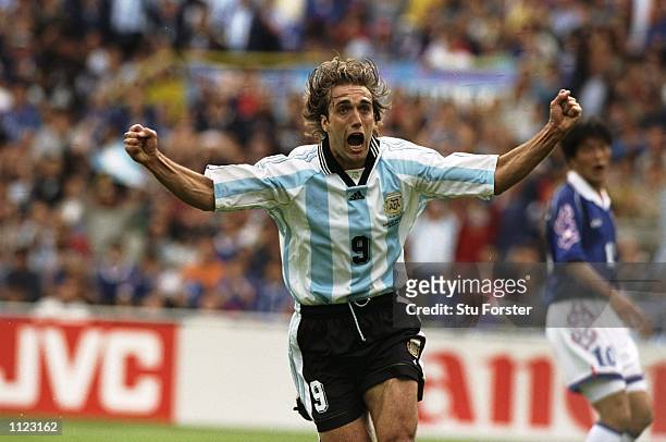 Gabriel Batistuta of Argentina celebrates after scoring in the World Cup group H game against Japan at the Stade Municipal in Toulouse, France....