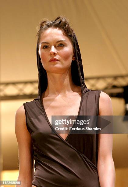 Anouck Lepere wearing Unique Spring/Summer 2006 during London Fashion Week Spring/Summer 2006 - Unique - Runway at Berkeley Square in London, Great...