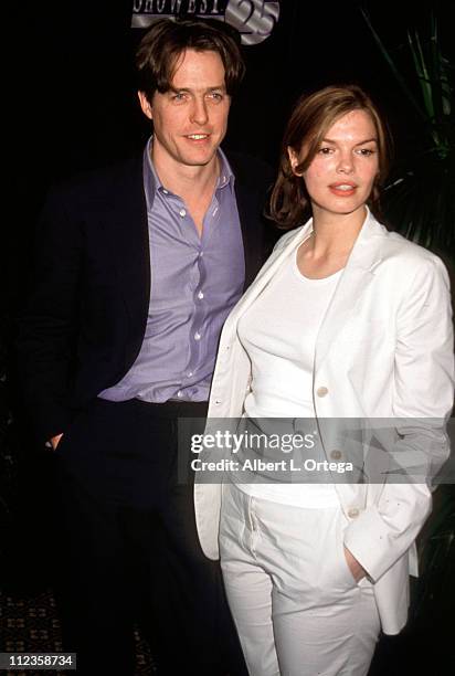 Hugh Grant and Jeanne Tripplehorn during 25th Annual NATO/ShoWest Convention - 1999 at Bally's Hotel & Casino in Las Vegas, Nevada, United States.