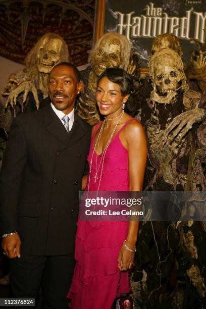 Eddie Murphy and Marsha Thomason during "The Haunted Mansion" World Premiere - Red Carpet at El Capitan Theatre in Hollywood, California, United...