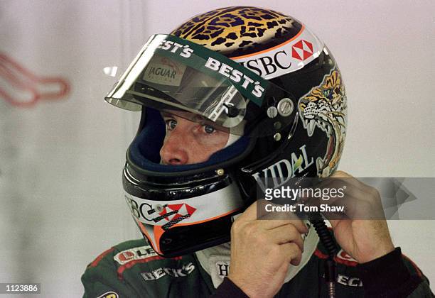 Eddie Irvine of Northern Ireland and Jaguar prepares for first timed practice for the Hungarian Grand Prix in Budapest, Hungary. Mandatory Credit:...