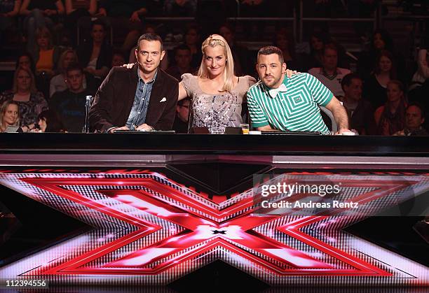 Jury members Till Broenner, Sarah Connor and DAS BO attend a photocall to promote the television music casting show X Factor at Arena Berlin on April...