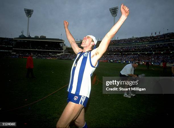 Corey McKernan of North Melbourne celebrates after North Melbourne won the AFL Football Grand Final in Australia. \ Mandatory Credit: Stuart Milligan...