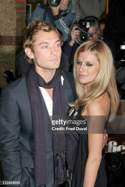 Jude Law and Sienna Miller during "Alfie" London Premiere for the Make a Wish Foundation - Arrivals at Empire, Leicester Square in London, Great...