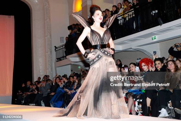 Dita von Teese walks the runway in front of Chompoo Araya Hargate, Miss Fame, Farida Khelfa and Mademoiselle Agnes Boulard during the Jean-Paul...