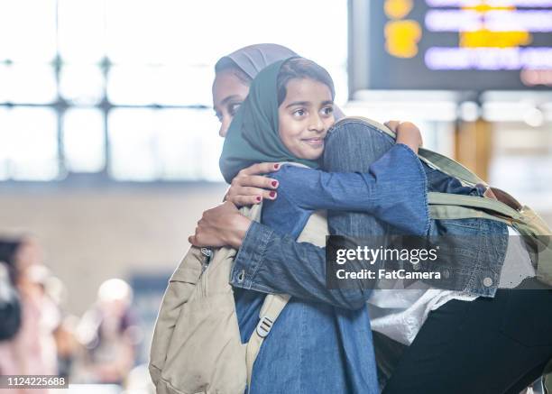 mother and daughter hugging - alien stock pictures, royalty-free photos & images