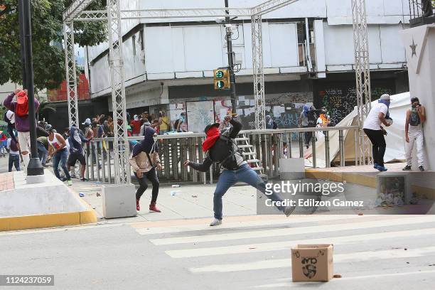 Demonstrators protest against the government of Nicolás Maduro before Venezuelan opposition leader and head of the National Assembly Juan Guaido...