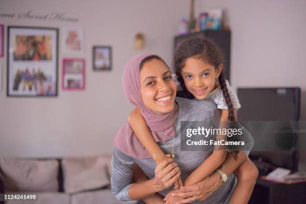 hugging mom - egyptian family stock pictures, royalty-free photos & images