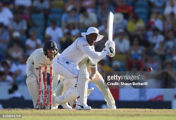 Shimron Hetmyer of West Indies plays a shot as Ben Foakes of England looks on during Day One of the First Test match between England and West Indies...