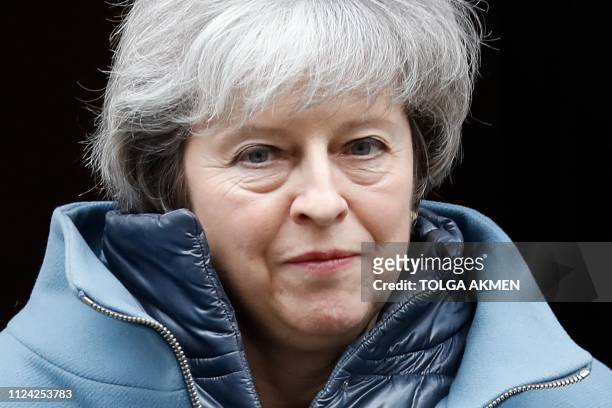 Britain's Prime Minister Theresa May leaves 10 Downing Street in London on February 12, 2019 ahead of a statement to Parliament on her Brexit deal....