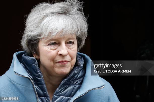 Britain's Prime Minister Theresa May leaves 10 Downing Street in London on February 12, 2019 ahead of a statement to Parliament on her Brexit deal....