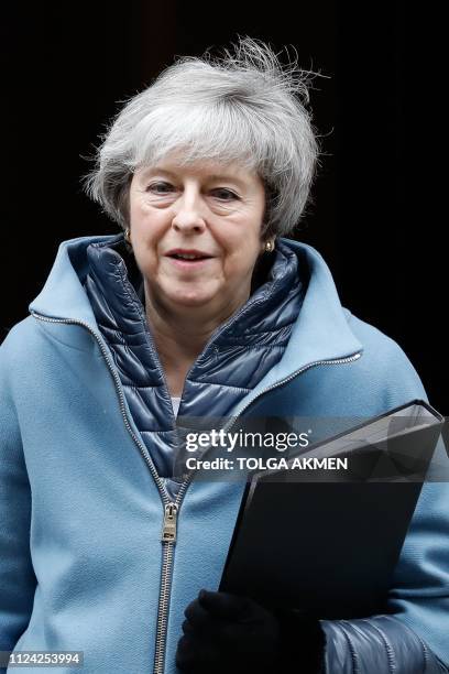 Britain's Prime Minister Theresa May leaves 10 Downing Street in London on February 12, 2019 ahead of a statement to Parliament on her Brexit deal....