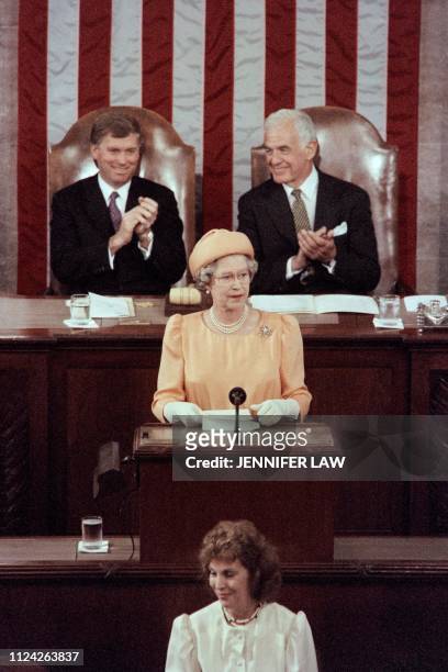 Vice President Dan Quayle and Speaker of the United States House of Representatives Thomas Foley applaud as Britain's Queen Elizabeth II adresses a...