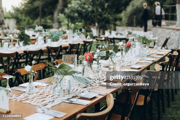 table setting for an event party or wedding reception - metal flower arrangement stock pictures, royalty-free photos & images