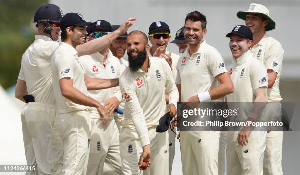 Moeen Ali and James Anderson are congratulated after combining to dismiss John Campbell of the West Indies during the fourth day of the third test...