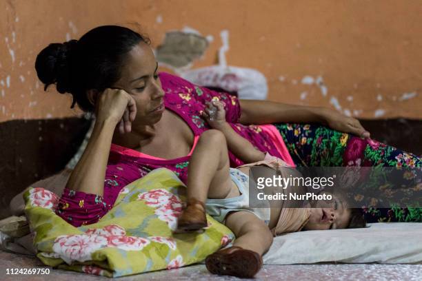 Venezuelans rest after several hours of walking in a refuge of the Samaritans Purse Foundation, Venezuelan migrants rest as they walk on the road...