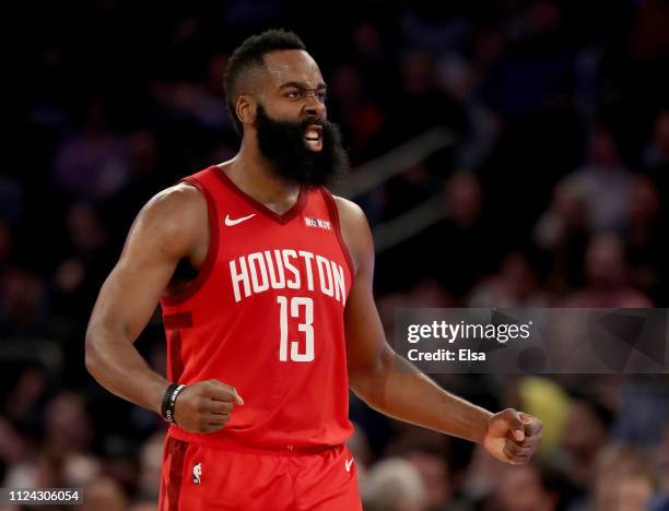 James Harden of the Houston Rockets celebrates after teammate Gerald Green dunked in the third quarter against the New York Knicks at Madison Square...