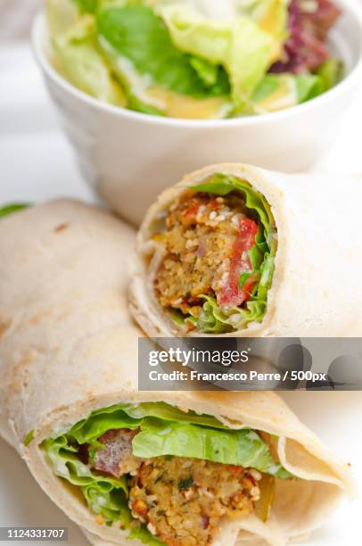 falafel pita bread roll wrap sandwich - chickpea powder stock pictures, royalty-free photos & images
