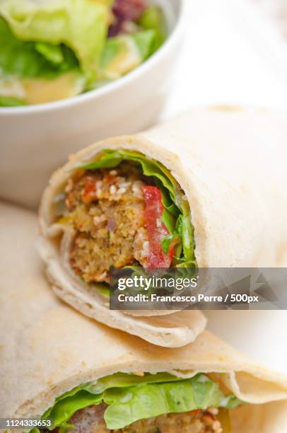 falafel pita bread roll wrap sandwich - chickpea powder stock pictures, royalty-free photos & images