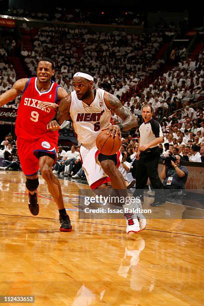 LeBron James of the Miami Heat drives to the basket against Andre Iguodala of the Philadelphia 76ers in Game Two of the Eastern Conference...