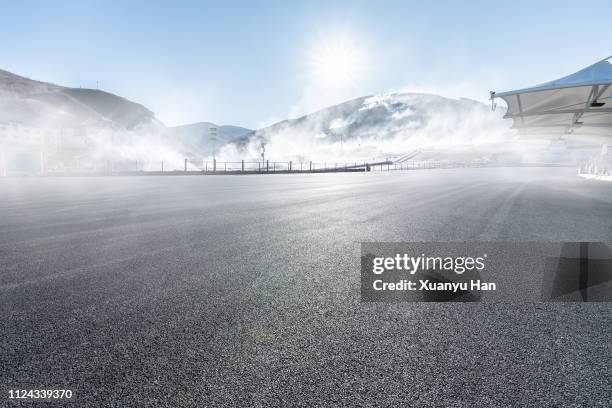 fog covered road - motor racing track stock pictures, royalty-free photos & images