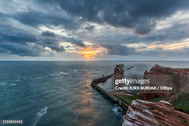 sunset on the island of helgoland - helgoland stock-fotos und bilder