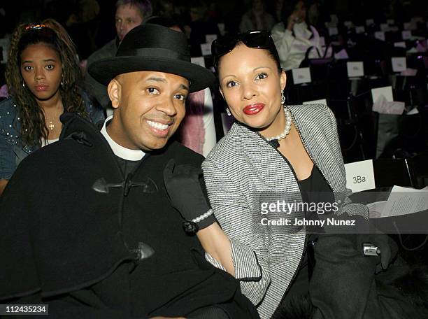 Reverend Run and Justine Simmons during Olympus Fashion Week Fall 2004 - Baby Phat - Front Row and Backstage at Gotham Hall in New York City, New...