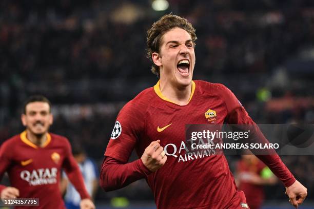 Roma Italian midfielder Nicolo Zaniolo celebrates after opening the scoring during the UEFA Champions League round of 16, first leg football match AS...