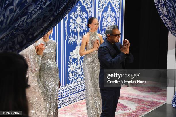 Designer Naeem Khan greets the audience with model Pat Cleveland at the Naeem Khan show during New York Fashion Week: The Shows at Gallery I at...