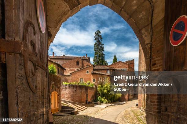 gate to palais de la berbie - albi stock pictures, royalty-free photos & images