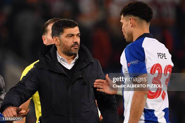 Porto's Portuguese coach Sergio Conceicao congratulates Porto's Brazilian defender Pepe at the end of the UEFA Champions League round of 16, first...