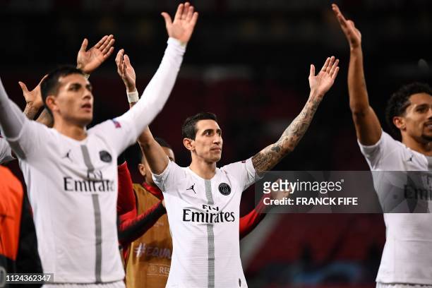 Paris Saint-Germain's Argentinian midfielder Angel Di Maria applauds the fans following the first leg of the UEFA Champions League round of 16...