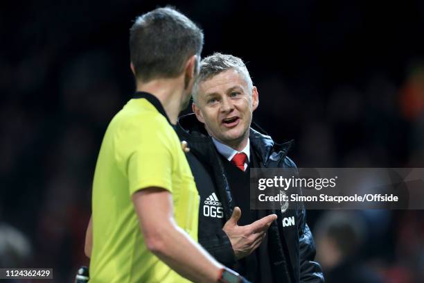 Man Utd manager Ole Gunnar Solskjaer speaks with referee Daniele Orsato at full time during the UEFA Champions League Round of 16 First Leg match...