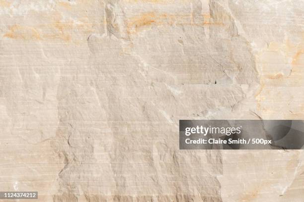 natural limestone background textured rock face wallpaper - limestone stock pictures, royalty-free photos & images